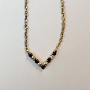Women&#39;s vintage costume gold necklace with (faux) onyx & diamonds