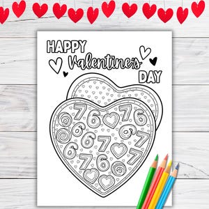 May include: Black and white Valentine's Day coloring page with a heart-shaped box of chocolates design. The box is filled with numbers and hearts. The words "Happy Valentine's Day" are at the top. Colored pencils are at the bottom.