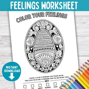 May include: A black and white feelings worksheet with the text "FEELINGS WORKSHEET" and "COLOR YOUR FEELINGS". The worksheet features a detailed egg-shaped design for coloring, with a key for selecting colors to represent feelings. Colored pencils are visible.