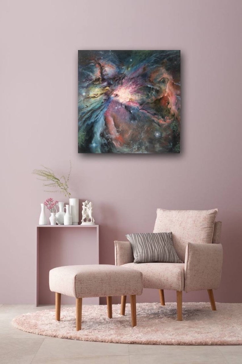 May include: A painting of a nebula in shades of pink, blue, and purple. The nebula is surrounded by a dark background with scattered stars.