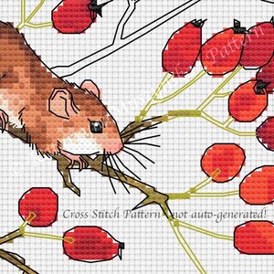 May include: A cross-stitch pattern featuring a brown mouse with long whiskers, holding a branch with red berries. The design includes green and brown stems, and the text "Cross Stitch Pattern not auto-generated!"