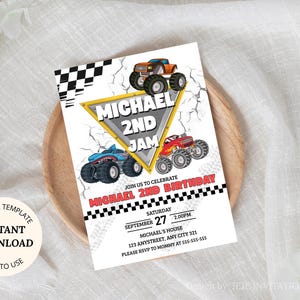 May include: A white invitation card with a monster truck theme. The card features illustrations of three monster trucks, the text "MICHAEL 2ND JAM", and event details. The card is on a wooden plate.