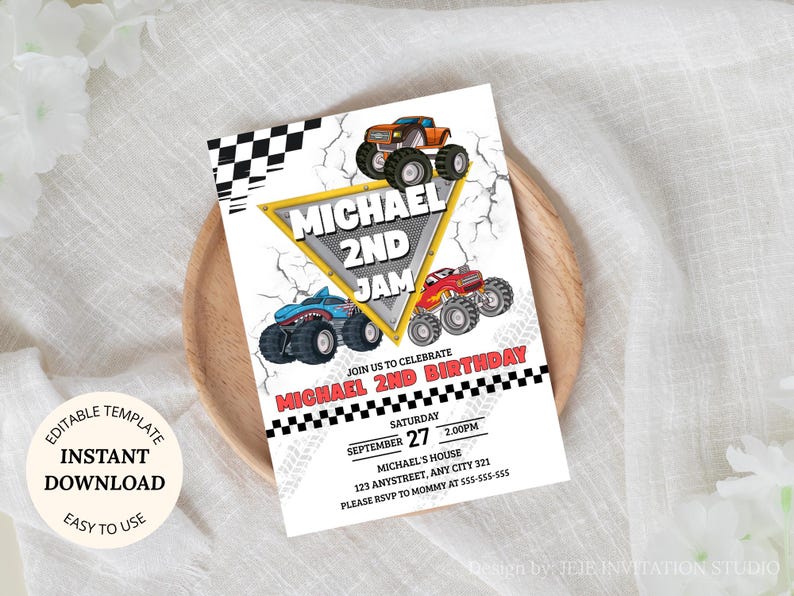 May include: A white invitation card with a monster truck theme. The card features illustrations of three monster trucks, the text "MICHAEL 2ND JAM", and event details. The card is on a wooden plate.