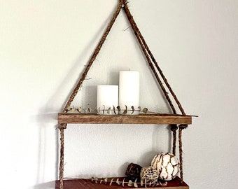 Rustic hanging shelf. Two tier shelf made from reclaimed barnwood.