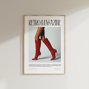 May include: A framed poster featuring the text "RETRO MAGAZINE" above an image of legs wearing red high-heeled boots. The poster includes text at the bottom, and is set against a white background.