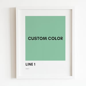 Puede incluir: Una impresión enmarcada con un fondo verde sólido y el texto "CUSTOM COLOR" en negro. La parte inferior de la impresión tiene el texto "LINE 1" en negro y "Line 2" en gris.