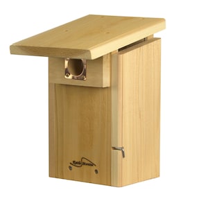 May include: A wooden birdhouse with a hinged roof and a small entrance hole. The birdhouse is made of natural wood and has a simple design. The birdhouse is labeled "Song Mountain".