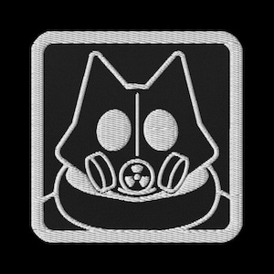 May include: Embroidered patch featuring a stylized cat wearing a gas mask, with a radiation symbol on the mask. The design is in white on a black square background with a white border.