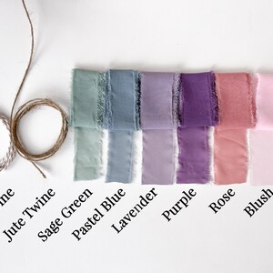 May include: Assortment of eight colours of ribbon, including sage green, pastel blue, lavender, purple, rose, and blush.  Also included are two spools of twine, one beige and one jute.
