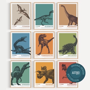 May include: A set of nine framed wall art prints featuring illustrations of dinosaurs and prehistoric creatures including Pteranodon, Velociraptor, Brachiosaurus, Plesiosaurus, Tyrannosaurus Rex, Ankylosaurus, Spinosaurus, Triceratops, and Dilophosaurus.