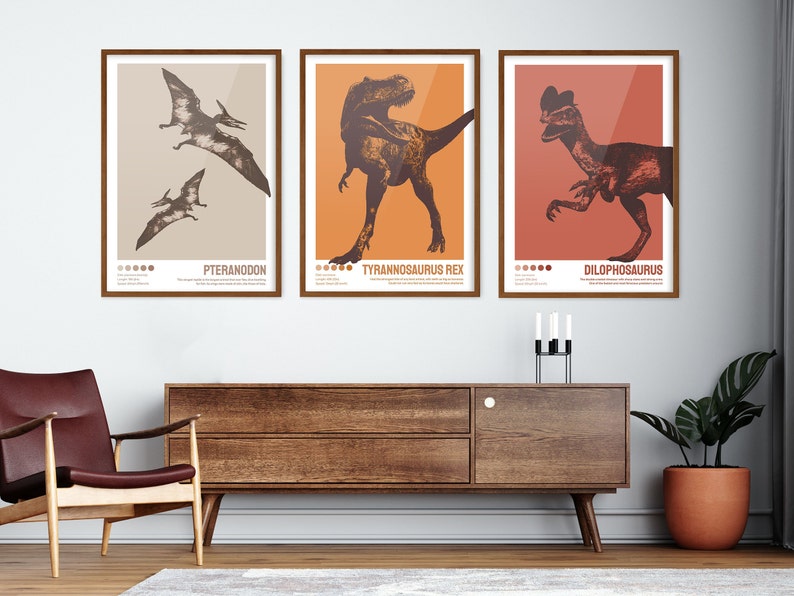 May include: Three framed illustrations of dinosaurs. The first illustration is of a Pteranodon, the second is of a Tyrannosaurus Rex, and the third is of a Dilophosaurus. The illustrations are in a vintage style with brown and orange colours.