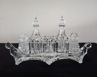 Antique crystal cruet set, gondola boat holding decanters and salt and pepper shakers