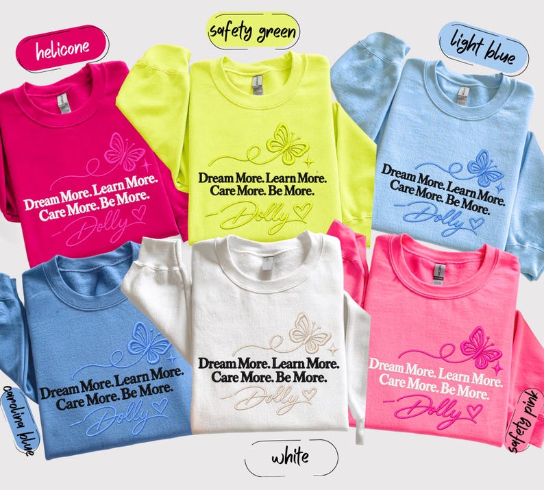 A collage of six colorful t-shirts with the same design, featuring the text "Dream More. Learn More. Care More. Be More." printed on them.