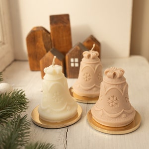 White candle “Bell” made of natural soy wax, festive kraft packaging, Christmas candle winter decoration