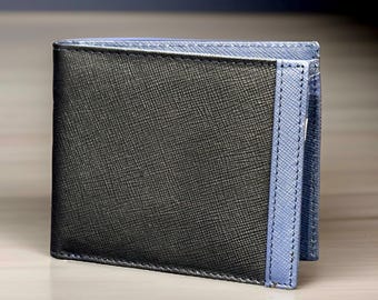 May include: A black leather wallet with a blue leather trim. The wallet has a textured surface and a stitched edge.