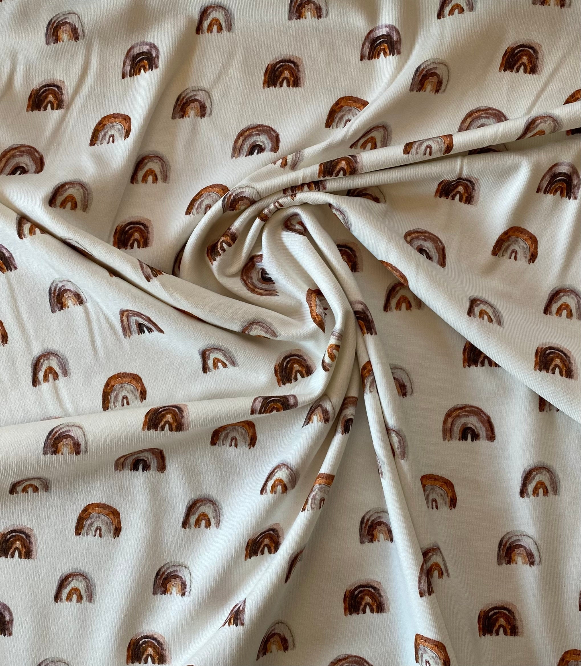 Jersey Stoff Regenbogen braun