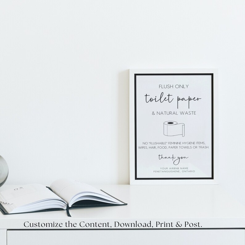 May include: A white sign with black text that reads "FLUSH ONLY toilet paper & NATURAL WASTE". A black and white illustration of a toilet paper roll is below the text. The sign also includes the text "NO "FLUSHABLE" FEMININE HYGIENE ITEMS, WIPES, HAIR, FOOD, PAPER TOWELS OR TRASH" and "thank you". The sign is on a white surface.