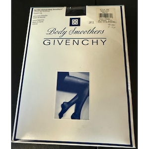 May include: A packet of Givenchy Body Smoothers control top tights in navy blue. The white packaging displays the brand name, style 554, and a central rectangular image showing dark blue hosiery on legs. Text includes Ref 554 Ultimate Body Smoothers.