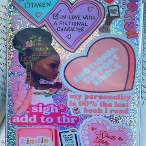May include: A clear phone case with a glittery background and various colorful stickers. The stickers include hearts, butterflies, and text such as "Bookish", "Emotional Support Kindle", "Sigh* Add to TBR", and "My personality is 90% the last book I read".