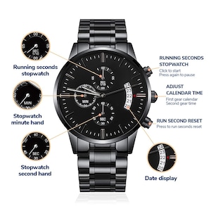 May include: Black stainless steel wristwatch with a black dial. Features include a stopwatch, date display, and a second hand. The watch has a matching black stainless steel band. The watch face has the text: "Running seconds stopwatch", "Stopwatch minute hand", "Stopwatch second hand".