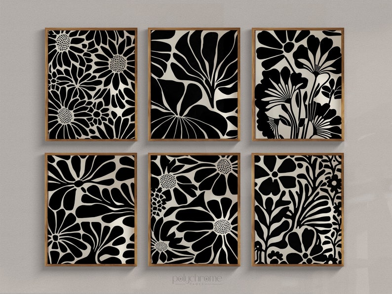 May include: Set of six black and white floral print wall art prints in wooden frames. The prints feature a variety of floral patterns, including daisies, leaves, and other abstract shapes.