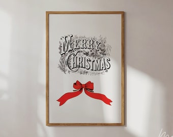 Könnte beinhalten: Gerahmter Druck mit dem Schriftzug "MERRY CHRISTMAS" in einer dekorativen Schriftart, mit einer roten Schleife am unteren Rand. Der Text ist in Schwarzweiß gehalten, und die Schleife ist rot. Der Rahmen ist hellbraun.