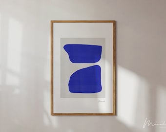 May include: A framed abstract art print with two blue shapes on a light gray background. The print is signed "Monad" in the bottom right corner.
