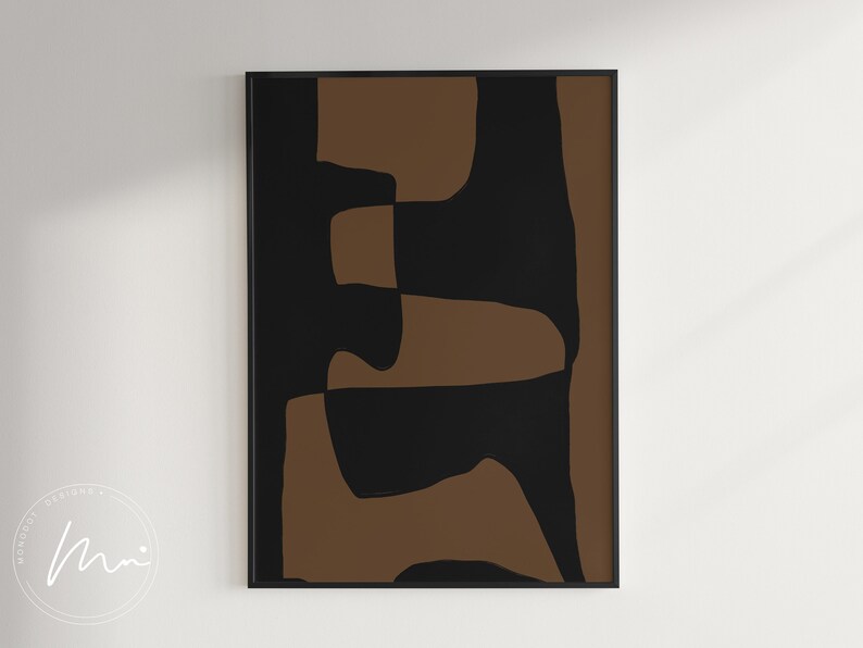 May include: Abstract art print with brown and black geometric shapes. The print is framed in a black frame.