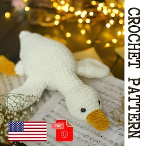 Motivo a uncinetto in peluche con oca. Simpatica oca di peluche fai da te. Modello di giocattolo all'uncinetto