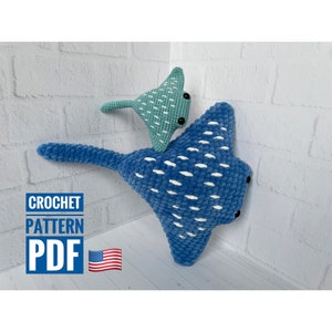May include: Crochet pattern PDF for making a blue and white stingray and a smaller teal stingray. The pattern includes instructions for crocheting the stingrays and adding details like eyes.