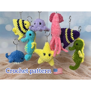 May include: Crochet pattern for a set of 8 colorful sea creature keychains. The set includes a blue whale, a yellow starfish, a purple octopus, a green seahorse, a pink squid, a yellow and black fish, a purple and yellow fish, and a green seahorse.