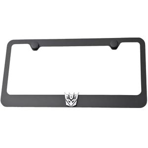 May include: Black metal license plate frame with a silver Transformers Autobot symbol.