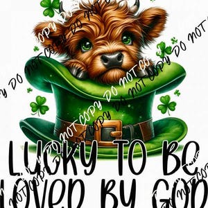 May include: A brown and white Highland cow wearing a green leprechaun hat with a gold buckle. The hat is decorated with shamrocks. The cow is looking at the viewer. The text "Lucky to be loved by God" is written below the image.