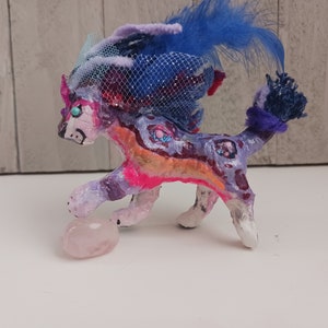 Plaster of paris cosmic Smilodon saber cat figure
