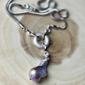 Large Baroque pearl pendant necklace with snake chain and crystal link.