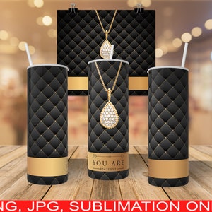 May include: Three black and gold sublimation tumblers with a diamond pendant design. The tumblers have a quilted pattern and the text "You Are Beautiful" on the middle tumbler.