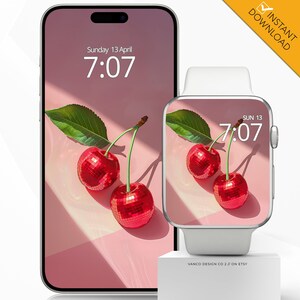 Könnte beinhalten: Ein digitales Telefon und eine Smartwatch zeigen einen rosa Hintergrund mit zwei roten Kirschen. Die Uhrzeit ist 7:07 auf beiden Geräten. Der Telefonbildschirm zeigt "Sunday 13 April" und der Smartwatch-Bildschirm zeigt "SUN 13".