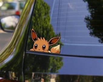 May include: A car window decal featuring a cartoon Eevee character peeking out. The decal is brown and tan. Text on the image reads "DOOZY DECALS", "WATERPROOF & UV PROTECTED", "4+ YEARS LIFESPAN", and "PREMIUM QUALITY VINYL DECALS".