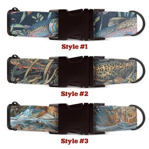 May include: Three different styles of dog collars with a trout print. The collars are made of a dark brown fabric with a black buckle. The first collar has a dark blue background with a trout swimming in the water. The second collar has a green background with a trout swimming in the water. The third collar has a light blue background with a trout swimming in the water. The collars are labeled "Style #1", "Style #2", and "Style #3".