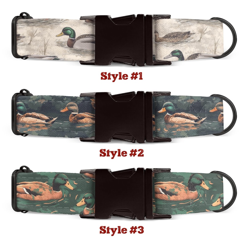 May include: Three styles of dog collars featuring a duck print design. The first style has a white background with brown ducks. The second style has a green background with brown ducks. The third style has a green background with brown and orange ducks. Each collar has a black buckle.