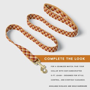 May include: A dog leash with a gold-colored clasp and a matching collar. The leash and collar feature a plaid pattern in shades of red, yellow, and cream. The text "COMPLETE THE LOOK" is displayed in a brown banner.