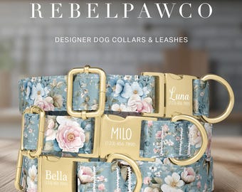 May include: Three floral-patterned dog collars with gold-colored buckles and nameplates. The collars feature a blue background with pink and white flowers. The names "Bella", "Milo", and "Luna" are engraved on the buckles. The text "REBELPAWCO" and "DESIGNER DOG COLLARS & LEASHES" are at the top.