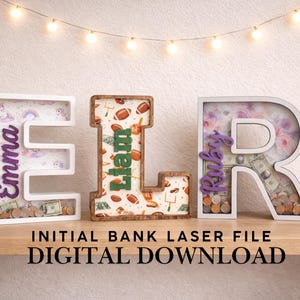 May include: Three decorative initial letter banks, each with a unique design. The letters are filled with themed images and names, with coins and bills visible inside. The text "INITIAL BANK LASER FILE DIGITAL DOWNLOAD" is at the bottom.