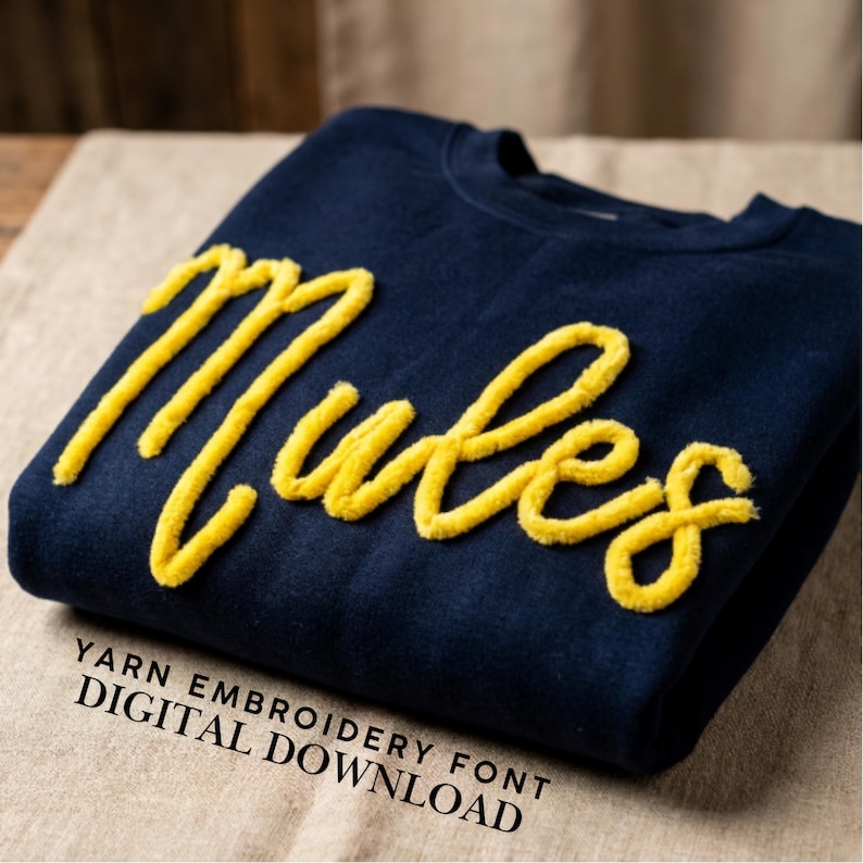 May include: A navy blue sweatshirt with the word "Mules" embroidered in yellow yarn. The text "YARN EMBROIDERY FONT DIGITAL DOWNLOAD" is printed at the bottom of the image.