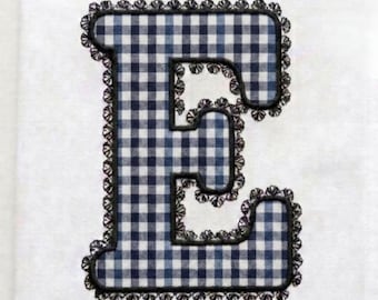 May include: An embroidered letter E featuring a navy blue and white gingham pattern. The letter is outlined with a black decorative scalloped lace border. The text LACE EMBROIDERY FONT is printed in black in the bottom right corner of the image.