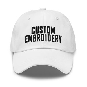 May include: White baseball cap with black embroidered text that reads "CUSTOM EMBROIDERY".