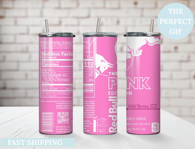 May include: Pink stainless steel tumbler with a straw, featuring the Red Bull logo and "The Pink Edition" text. The tumbler includes nutrition facts and "Wild Berries" flavor information. The text "The Perfect Gift" is also visible.