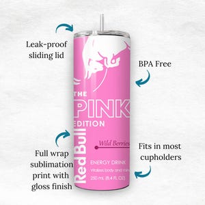 May include: Pink Red Bull tumbler with a white logo and the text "THE PINK EDITION". Features include a leak-proof sliding lid, full wrap sublimation print, and BPA-free construction. Holds 8.4 fl oz and fits in most cupholders.
