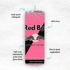 May include: A pink and black insulated tumbler with the Red Bull logo and text. The tumbler has a leak-proof sliding lid and is BPA-free. It features a full wrap sublimation print with a gloss finish and fits in most cup holders.