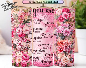 May include: A floral tumbler with a pink and white design. The tumbler is covered in pink and red flowers. The words "you are" are written in black script, with inspirational words and Bible verses. A silver straw is included.